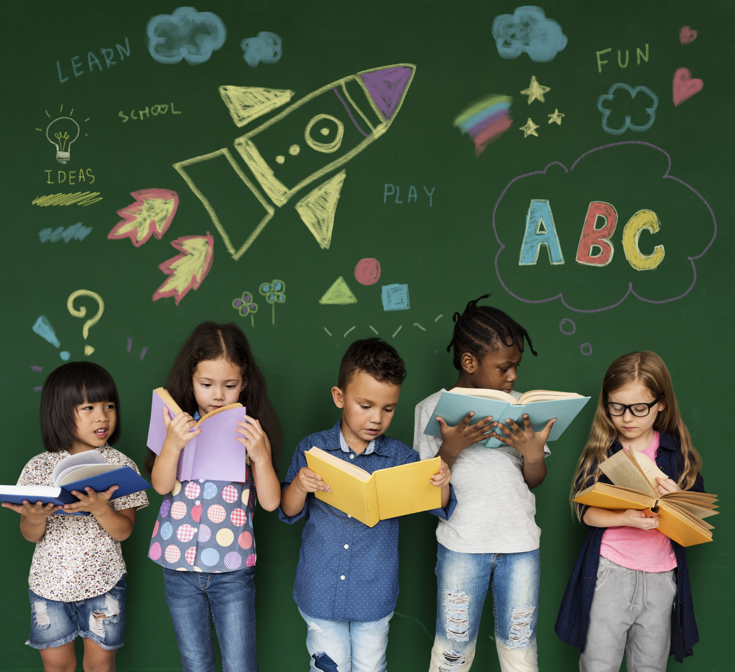 Diverse children reading books together in a classroom